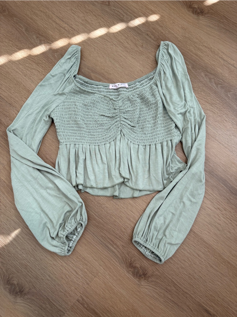 Smocked Peplum Long-Sleeve Top in Sage Green